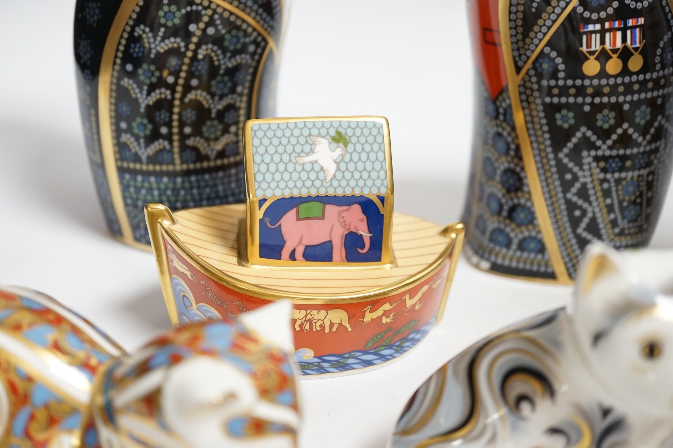 A collection of Royal Crown Derby porcelain and paperweights including Pearly Queen, Pearly King, Russian, etc.